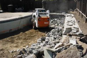 Salinas pool demolition job in progress